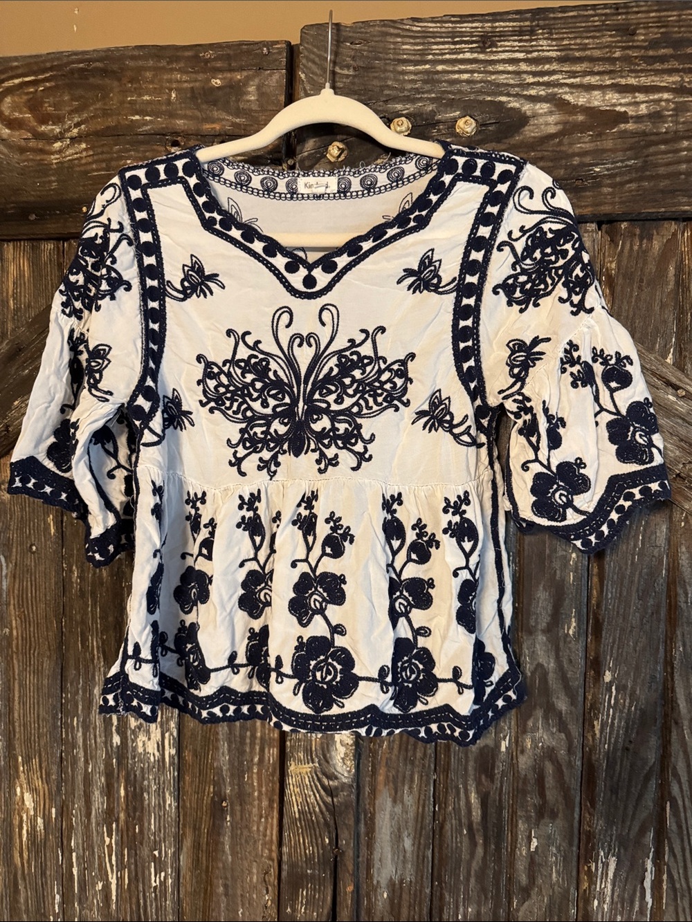 Anthropologie Kindred White Peasant Blouse with Navy Embroidered Floral Detail